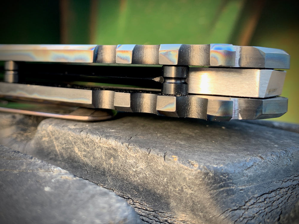 Praetorian Ti - S35VN Satin Tanto Blade PVD Handles w/Flamed Pinstriping Flamed Ti Pivot/Spacers w/PVD Screws Brushed/Flamed Clip Breaker