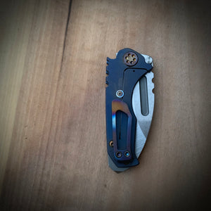 Medford Knife & Tool Micro Praetorian T - S35VN Tumbled Drop Point Blade Bright Ano Blue Handles Flamed Hardware Brushed/Flamed Clip NP3 Breaker